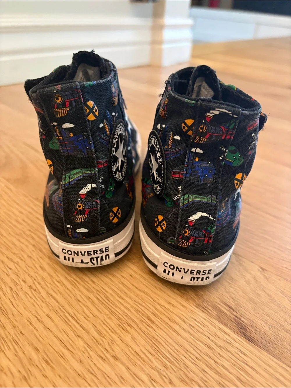 Kids Converse High-Top Sneakers in Black with Colorful Train Print